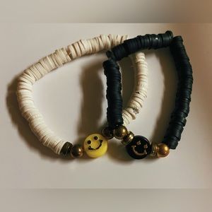 two pack handmade clay bead friendship bracelets black & white.
